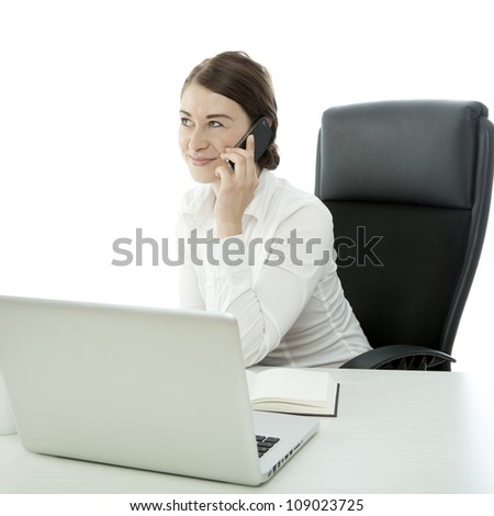 young brunette business woman call cell phone behind desk
