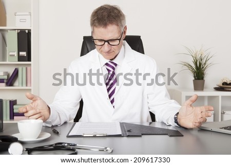 Medical Expert Reading Medical Reports with Open Hands While Having Coffee at Side