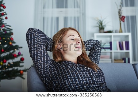 young cute girl is relaxing after busy christmas stress