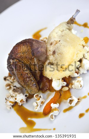 Roast pigeon and pigeon donut, popcorn and dried apricots, veal sauce