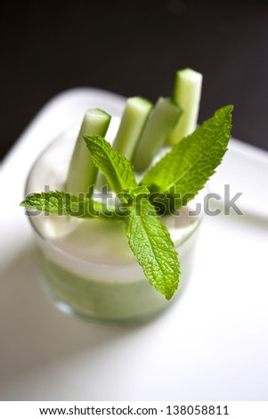 Cucumber mousse and mint leaves in a glass
