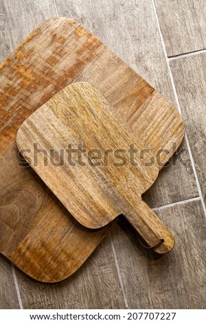 Wooden cutting board on a wooden floor