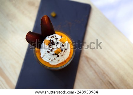 Mango mousse and Chantilly cream in a glass