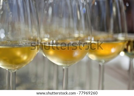 Glasses of white wine to taste, on a table of a wine shop