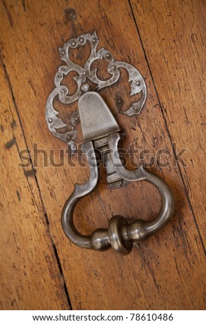 Old knocker on an oak door