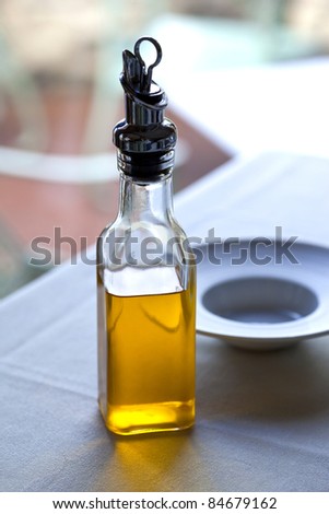 Small bottle of olive oil on a restaurant table