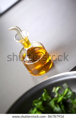Olive oil and spinach salad in the kitchen