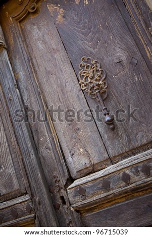 Old wooden door in a village of Provence, France