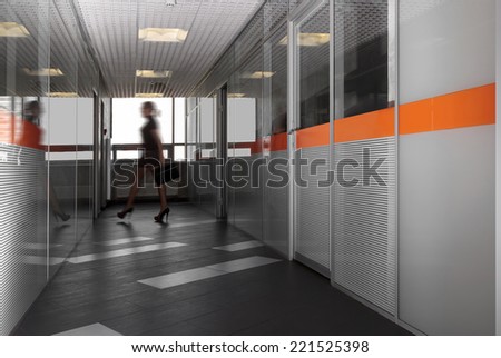 modern office hallway with a silhouette of business woman