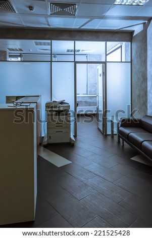 modern office entry hall with reception desk and couch