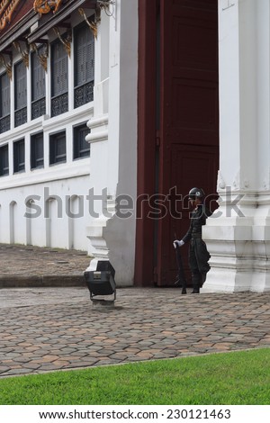 BANGKOK, THAILAND- OCTOBER 26, 2014: An unidentified soldier stands guard at the Grand Palace. A popular tourist destination, the Grand Palace is guarded by a regiment of soldiers.
