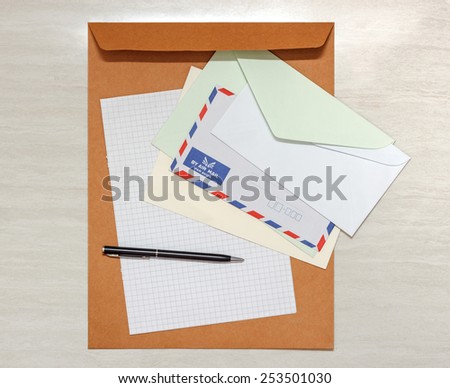 A set of blank envelopes with paper and pen view 3