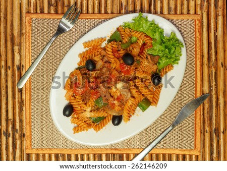 Natural light photo of macaroni pasta with bolognese sauce and parmesan cheese on a white plate top view 2