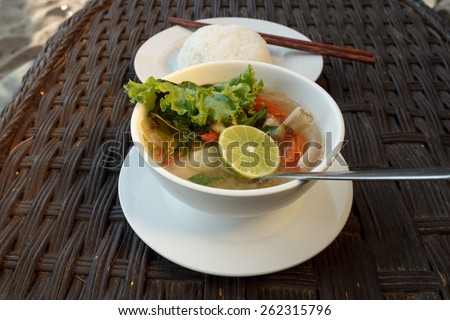 Natural light photo of lemongrass seafood soup with steamed rice, shallow DOF view 2