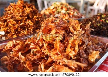 Street photo of asian market food in Cambodia. Pile of dried fish