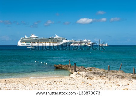 GEORGE TOWN, CAYMAN ISLANDS - NOVEMBER 3: Cruise ships anchored at the harbor of Grand Cayman for this popular stop of cruise lines on nov 3, 2011 in George Town, Cayman Islands.