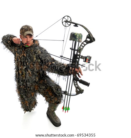 Hunter aims a compound bow and arrow