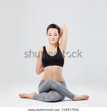 young beautiful yoga posing on a studio background young beautiful yoga posing on a studio background