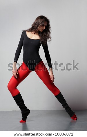 stock photo cool girl doing aerobic exercise on a grey background