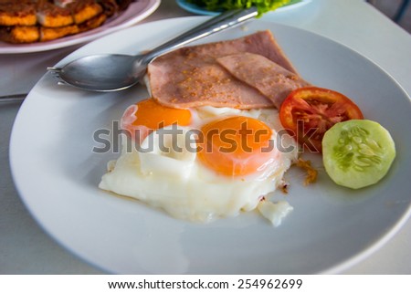 American breakfast fried egg with ham