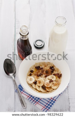 delicious porridge with banana, dates, cinnamon and maple syrup