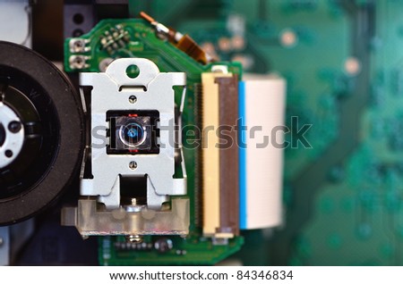 Close up shot of an optical device. This device usually operating inside a CD ROM or DVD device to read or write data.