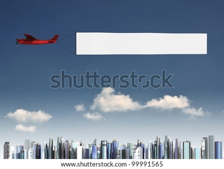Flying banner pulled by airplane flying over a modern city building
