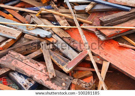 pile of old , dirty and broken wood