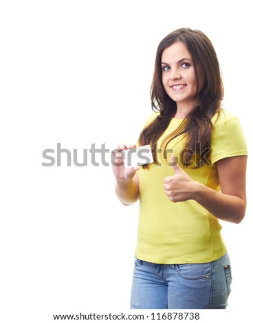 Attractive smiling young woman in a yellow shirt holding poster in her right hand and left hand showing thumbs up. Isolated on white background