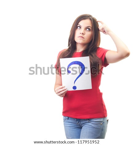 Attractive young woman in a red shirt holds a poster with a big question mark and looks into the upper-left corner. Isolated on white background