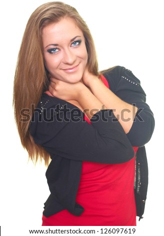 Happy young woman in a black sweater and a red shirt. Hugs her arms around her neck. Isolated on white background