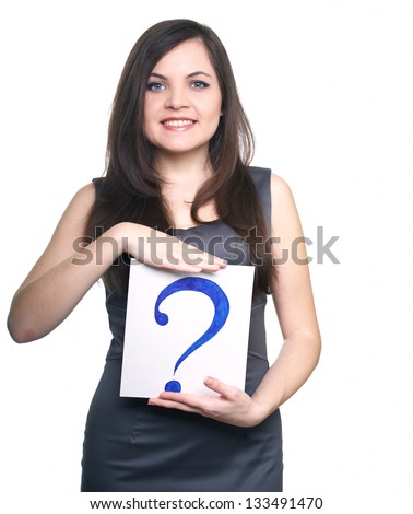 Attractive young woman in a gray business dress. Woman holds a poster with a big question mark. On  a white background