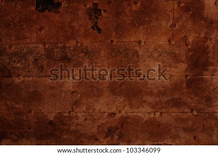 old rusty iron surface with rivets