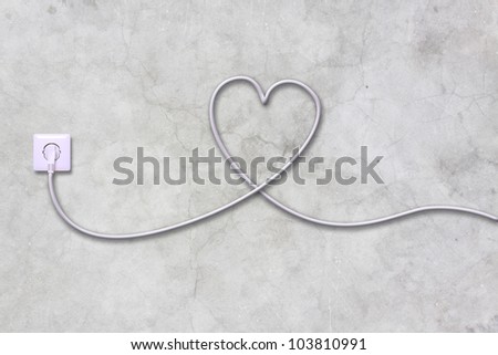 electrical outlet and wire in the shape of a heart