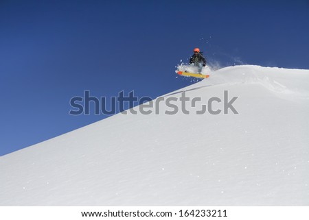 Snowboard freerider  in the mountains
