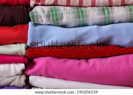 Pile of colorful clothes, stack of clothing