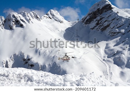ski resort in the mountains, ski lift and helicopter