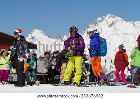 SOCHI, RUSSIA - MARCH 22, 2014: Tourists in mountain ski resort Rosa Khutor,