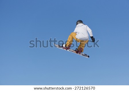 Snowboarder jumps in Snow Park, big air