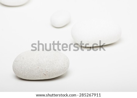 natural white pebbles on white background