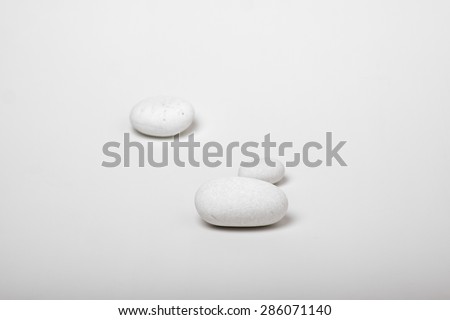 natural white pebbles on white background