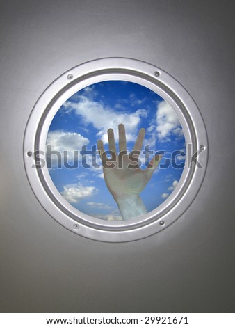 human hand, through the window of airplane