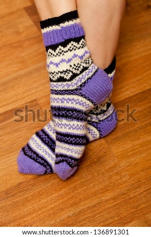 knitted wool socks on woman's feet