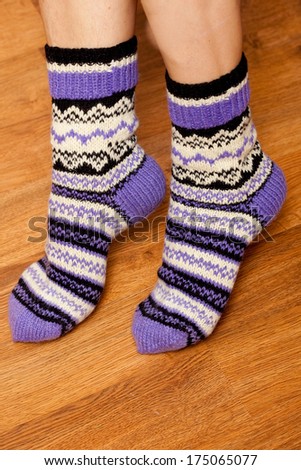knitted wool socks on woman\'s feet