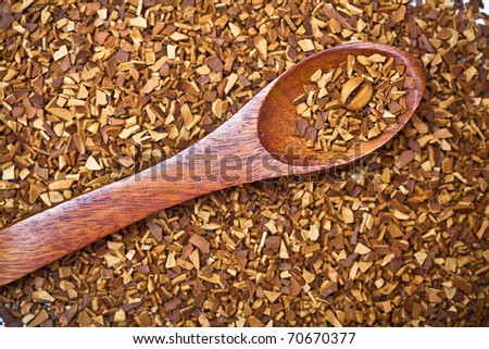 wood spoon of soluble coffee with coffee bean