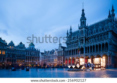Wide angle evening scene of the Grand Place, the focal point of Brussels, Belgium. The Town Hall (Hotel de Ville) is dominating the composition.
