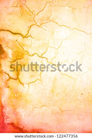 Old shabby wall: Abstract textured background with red, brown, and orange patterns on yellow backdrop. For art texture, grunge design, and vintage paper / border frame