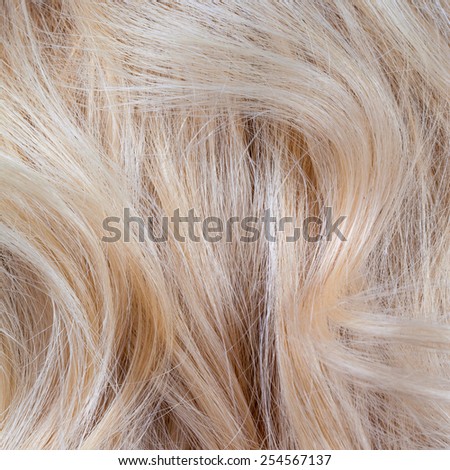 Wavy blonde woman hair background and texture