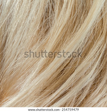 Wavy blonde woman hair background and texture