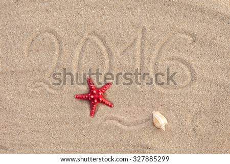 Photo calendar with starfish and seashells on sand beach. Cover  2016